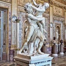 a statue of two people in a building