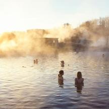 a group of people swimming in the water