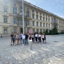 a group of people standing in front of a building
