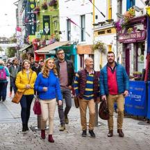 a group of people walking down a street
