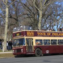 a double decker bus driving down a street