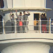 a group of people standing on top of a lighthouse