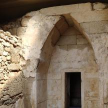 an entrance to a stone building with a doorway