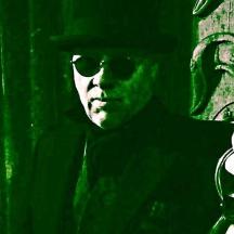 a man wearing sunglasses and holding a mirror