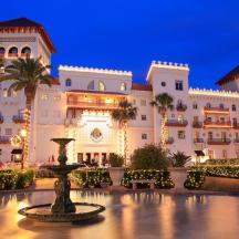 a large building with a fountain in front of it