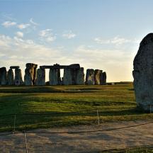 an prehistoric monument with a large rock in a field