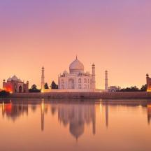 a view of the taj mahal at sunset