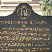 a sign for a tombo chi chi charities grave
