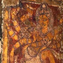 a painting of a woman on a wall