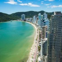 an aerial view of a city and a beach