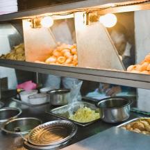 a kitchen with a bunch of food on a counter