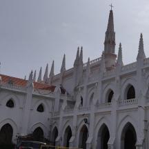 a large white building with crosses on top of it
