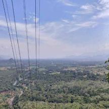 an overhead view of a valley with power lines