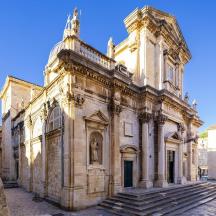 an old stone building with steps in front of it