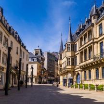 an empty street in a city with many buildings