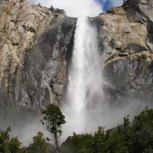 a waterfall on the side of a mountain