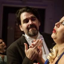 a man and a woman are clapping their hands