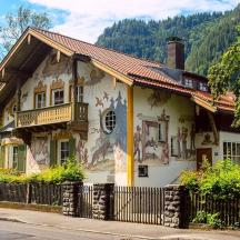 a house with paintings on the side of it