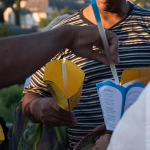 a man holding a yellow object in his hand