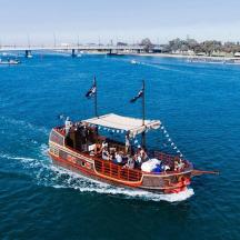 a boat with people on it in the water