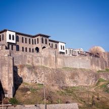 a castle on top of a rocky mountain