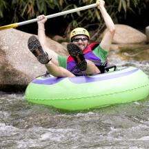 a man is in a raft in the water