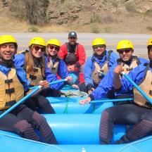 a group of people in a raft on a river
