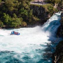 a raft in the middle of a waterfall on a river