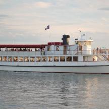 a boat with people on it on the water