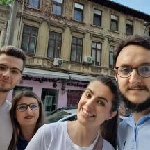 a group of people standing in front of a building