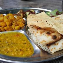 a plate of food with a plate of indian food