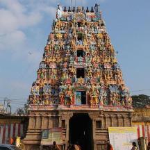 a large tower with people sitting on top of it