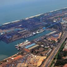 an aerial view of a harbor with a bridge