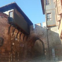 a brick wall with an archway in a building