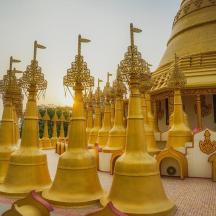 a golden temple with crosses on top of it