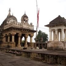 an old building with a clock tower next to