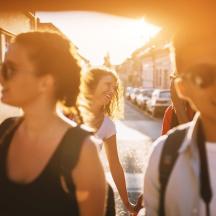 a group of people walking down a street