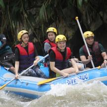 a group of people in a raft on a river