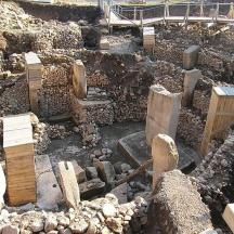 a construction site with logs and wooden beams