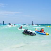 a group of people riding on a jet ski in the ocean