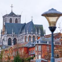 a large church with a tall tower and a street light