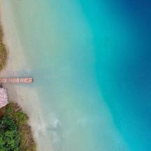 an overhead view of a beach and the ocean