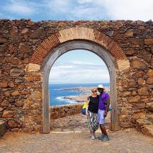 a man and a woman standing in an archway