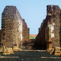two ruins of a building with two towers