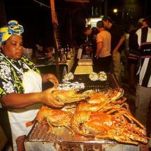 a man is preparing a turkey on a grill