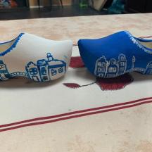 a cake with blue and white shoes on a table