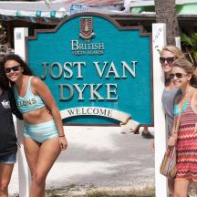 a group of people standing in front of a lost van dyke sign