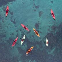 a group of people in kayaks in the water