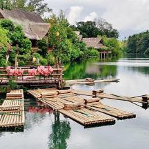 a group of chairs sitting on a dock in the water