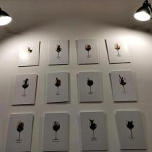 a wall with a bunch of pictures on a wall with lights